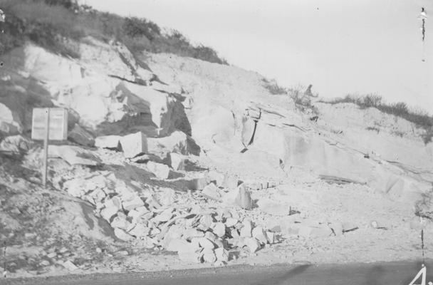 Project #30 District 4: Construction of a new City Hall at Cumberland, Harlan County, KY. This project was partly completed under E.R.A. Native sandstone used in this building is quarried on the same project from a site about .5 mile west of the city. View of the quarry from which stone is furnished for building the City Hall. One of the few locations where the stone is uniformly pink in color