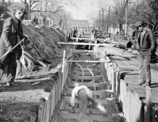 Project #610 District 1: Laying of 14,000 feet of sewer pipe in the City of Owensboro, KY. View of project showing ample shoring and bracing for the protection of workmen. Photographed January 21, 1936