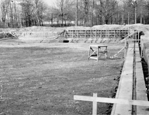 Project #104 District 1: Construction of a concrete swimming pool, 200' long and 100' wide in Noble Park, Paducah, KY. View of far side of pool shows forms in place for concrete wall. Photographed January 22, 1936