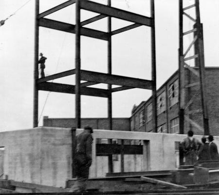 Project #1876 District 3: Completion of superstructure of an addition to Bryan Station School in Fayette County. The addition will contain seven additional classrooms and a study hall. The view shows concrete foundation and structural steel framing in process of construction. Photographed March 23, 1936