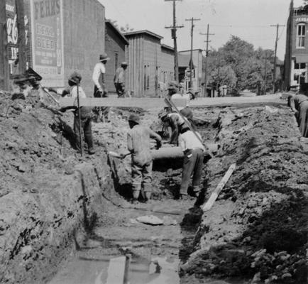 Project #? District 3: Reconstruction of streets and replacement of sewers in the City of Nicholasville, KY. Some of the streets are to be surfaced with rock asphalt. The view, photographed May 25, 1936, shows excavation for sewer replacement