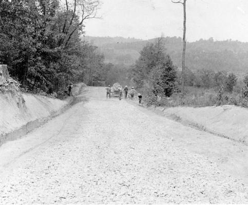 Project #2685 District 1: The grading, draining and surfacing of 5 miles of the Easton-Lyonia Road in Hancock County and of 6.9 miles of the Humphrey-McFall Road in Union County are provided respectively by project #2685 (now included under Master Project #2732) and by Project #1479 (now included under Master Project #2740). Views of the work on the two road reconstruction jobs. Crushing and laying base stone on Easton-Lyonia road in Hancock County. Photograph taken September 1, 1936