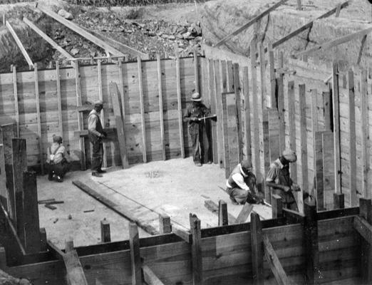 Project #2804 District 2: Sewage Disposal Plant, Columbia, KY. Master Project #2804 provides for completion of the sewerage system, including construction of a sewage disposal plant and for extension of the water system in the City of Columbia, KY. Workmen shown setting forms for concrete walls of disposal plant. View photographed June 26, 1936