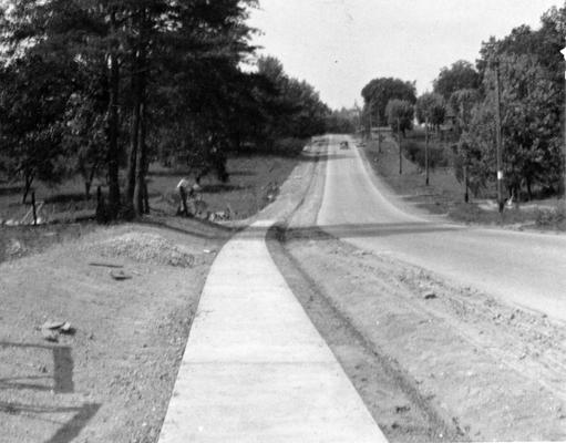 Project #2798 District 4: Project #2798 is the reconstruction of various streets and sidewalks in London, KY. The streets have a napped sandstone base and a limestone top surface and sidewalks are constructed of concrete. Completed concrete sidewalk. View photographed September 25, 1936