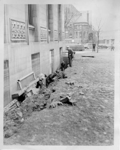 WPA workers repairing a cave in on the north side of the Louisville Free Public Library after the 1937 flood