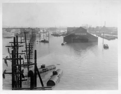 First and Main Streets in Louisville, KY, showing flood waters and railroad tank cars afloat at the L  &  N Railroad Depot