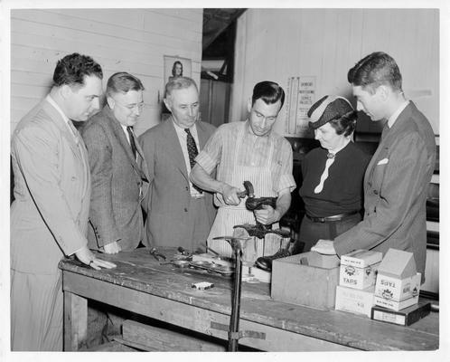 Matthew Henchey, Director, Jefferson County Welfare, Andrew Broaddus, Chairman, Board of Alderman, George H. Goodman, State WPA Administrator, Mrs. Blanche M. Ralston, Professional and Service Regional Director, Charles J. Rieger, Acting Director of Welfare, inspecting Shoe Repair Project, May 22, 1940