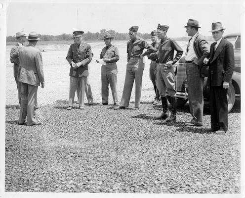 Runways under construction at Flying Field inspection, May 18, 1939. General Adna R. Chaffee is 3rd from right, Colonel W.A. Danielson is 3rd from left. Also present: E.A. Marye, R.J. Turrell, F.E. Lackey, Jr., McDonald Darnell