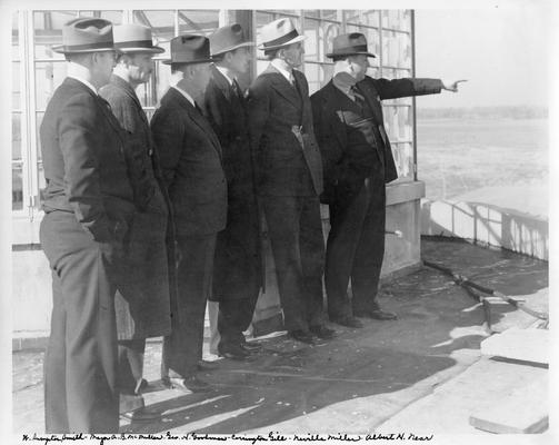 Federal officials inspecting Louisville airport, November 4, 1937. (Left to right): W. Sumpter Smith, Major A.B. McMullen, George H. Goodman, Corrington Gill, Neville Miller, and Albert H. Near