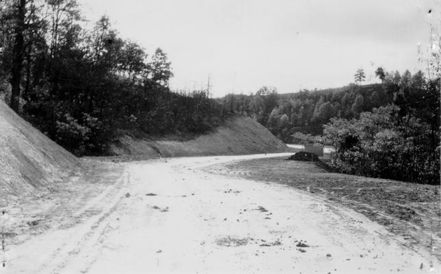 Project #248 District 6: Completion of Mitchell Hill Road, widening of grade and resurfacing. Base to be widened from 10 feet to 16 feet. View showing banks sloped and grade completed to receive surfacing. Picture taken October 30, 1935
