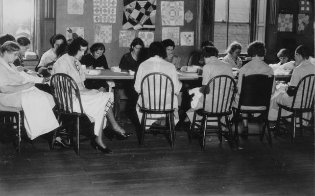 Project #275 District 6: Project No. 275 is a Louisville Sewing Center, where women are taught sewing, patching, household management and childcare. A Louisville sewing center project in operation. Photographed November 13, 1935