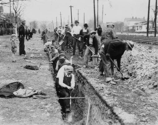 Project #1293 District 6: Construction of sewers in Ward #8, City of Louisville. Excavation for installation of sanitary sewer, Taylor Blvd., between Peck and Henry streets. Photographed November 25, 1935