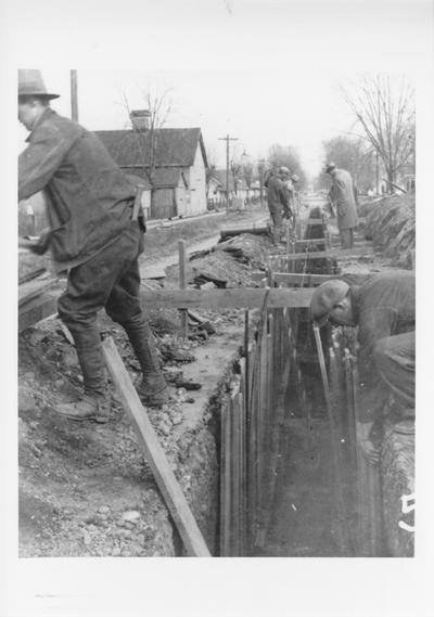 Project #91 District 3: Project provides for the laying of approximately 28,000 linear feet of sanitary sewer in the City of Carrollton. Open trench showing shoring in place for protection of workers. Photographed November 26, 1935