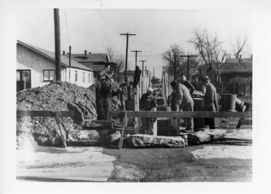 Project #1294 District 6: Construction of sewer in Nevada Avenue, Ward No. 4, City of Louisville. 2140 lineal feet of sewer to be laid. Open trench for sewer construction with sheeting and shoring in place. Nevada Avenue, east from Park Avenue. Photographed December 9, 1935