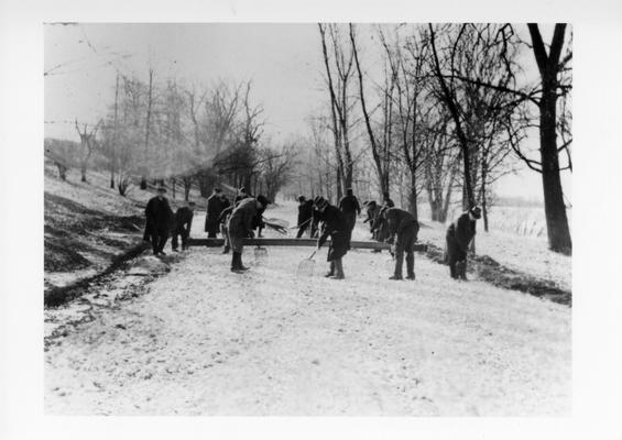 Project #249 District 6: Spreading rock on Mt. Washington Road. Photographed December 9, 1935