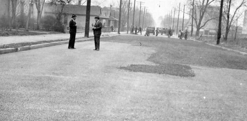 Project #536 District 1: WPA Project #536 provides for the reconstruction of 77,216 square yards of streets with a concrete base and a 1.5 inch black top. The photograph, taken March 20, 1936, shows the primed surface on South Third Street in Paducah, KY