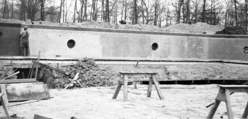 Project #104 District 1: Work is progressing satisfactorily on WPA Project #104, which is the construction of a concrete swimming pool at Noble Park in the City of Paducah, KY. The view, photographed March 20, 1936, shows the north wall of the pool as poured