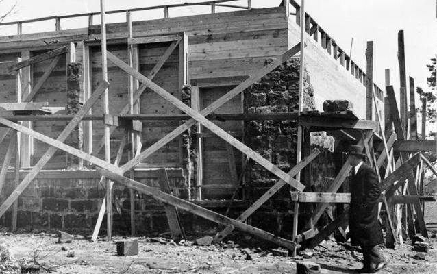 Project #1171 District 2: WPA Project #1171 is the construction of a two-room graded school building of native sandstone at Clear Creek. The photograph, taken April 7, 1936, shows part of two walls laid with stone