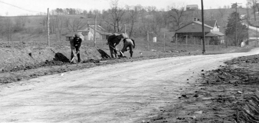 Project #1622 District 6: WPA Project #1622 provides for grading, draining, and surfacing the Scott's Station Road in Shelby County. Workmen are shown dressing shoulders and banks in the photograph, taken March 25, 1936