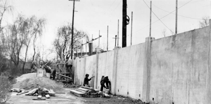 Project #1284 District 3: View of another section of the new concrete fence at Stoll Field, University of Kentucky campus, Lexington, KY, after removal of forms. Photographed March 23, 1936