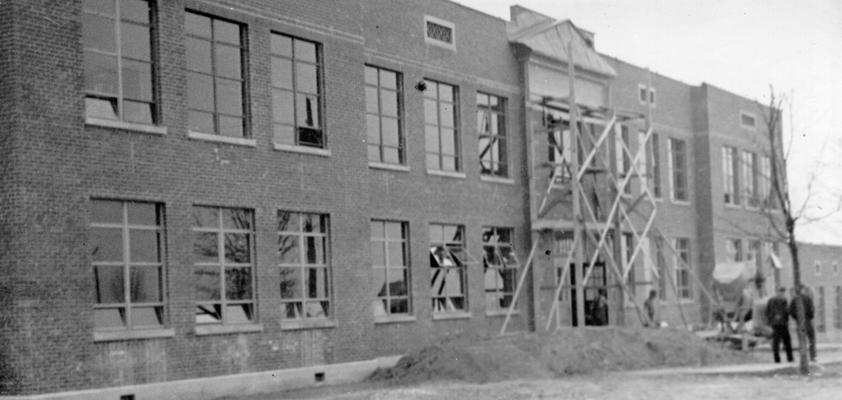 Project #2214 District 1: WPA Project #2214 undertakes the completion of the new Barlow School at Barlow, KY. Work on this structure, a two-story brick building, 107' X 144' in dimension, was started by K.E.R.A. Front view showing building nearing completion. Photographed March 3, 1936