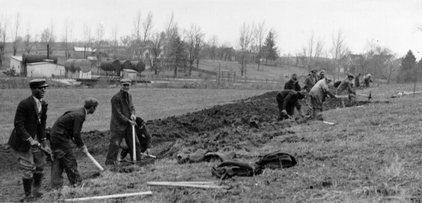 Project #548 District 3: WPA Project #548 consists of grading and draining 4.23 acres outside of the City of Carlisle, KY, for use as a playground and athletic field. Grading athletic field at Carlisle. Photographed February 24, 1936