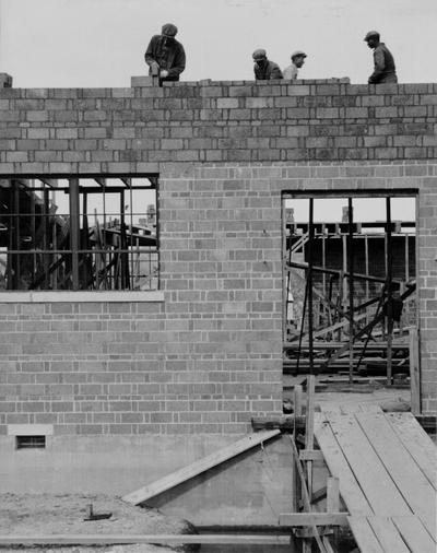 Project #1206 District 2: Construction of an auditorium-gymnasium building for the high school at Marrowbone, KY. The concrete brick walls of the structure were nearing completion at time photograph was taken, April 17, 1936