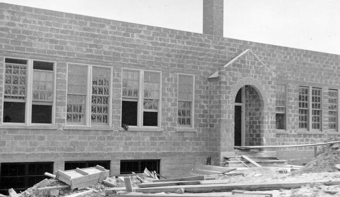 Project #577 District 1: Construction of a concrete block high school building at Linton, KY. Structure contains four classrooms and office and a gymnasium. View photographed May 6, 1936, shows exterior of building completed