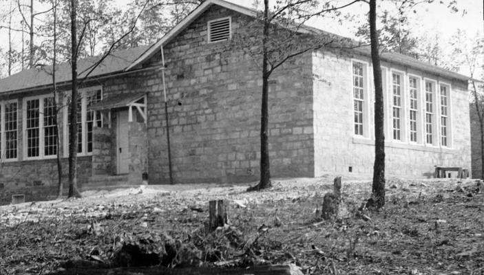 Project #1181, Master Project #2831 District 2: A two-room schoolhouse of native sandstone has been constructed at Parkers Lake under WPA Project #2831, formerly Project #1181. View, photographed May 6, 1936, shows completed exterior of the building