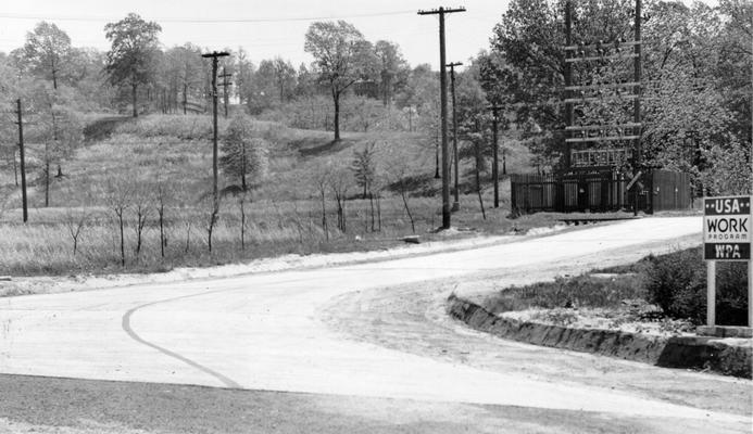 Project #1037 District 6: Improvement of Hospital Drive. Re-alignment and repair of the main entrance road to Waverly Hills Sanitarium in Jefferson County. View, photographed May 6, 1936, of the south wing of the entrance, shows concrete surface and grading completed