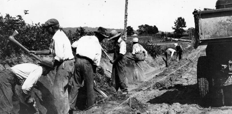 Project #786 District 6: WPA Project #786 provides for grading, draining and surfacing 5.5 miles of the Cane Spring Road in Bullitt County from Cedar Grove Church to the Nelson County line. Men at work on ditching and grading of the road, shown in photograph taken June 10, 1936