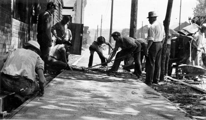 Project #2814 District 3: Construction of streets in the City of Newport, KY. The photograph, taken June 9, 1936, shows construction of a portion of Newport sidewalks