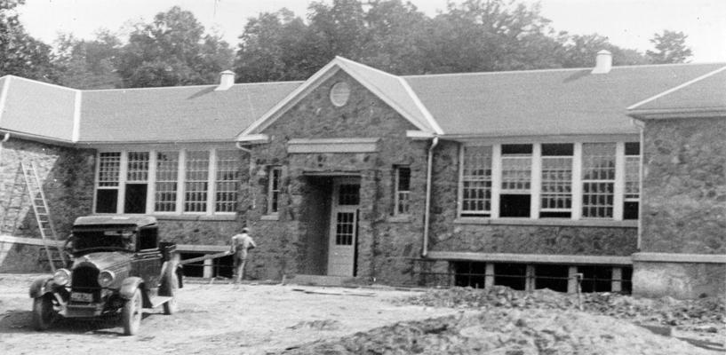 Project #1216 District 4: Ten-room school building in Knox County. Construction of a native sandstone junior high school building at Flat Lick, KY. The front of the new school is shown in the photograph taken July 17, 1936. There are ten classrooms in this building, which is 93' X 128' in dimension