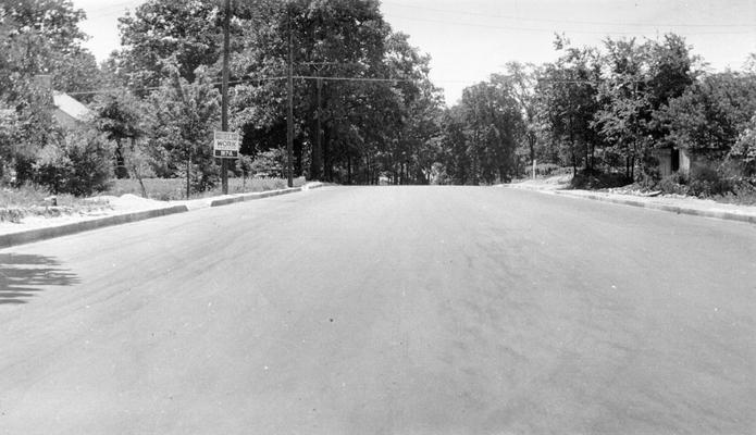 Project #804 District 6: WPA Project #804 is the construction of 15,442 square yards of streets in the City of Bowling Green, KY. The view, photographed May 27, 1936, shows a completed street with native rock asphalt surface