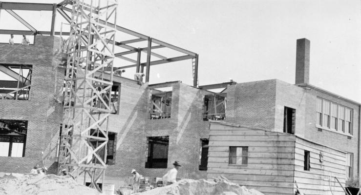 Project #1876 District 3: Addition to Bryan Station School. Workmen laying brick walls of the addition to the Bryan Station High School Building, Lexington, KY. Construction of the addition is Project #1876, now a unit of Master Project #2815. View was photographed July 10, 1936