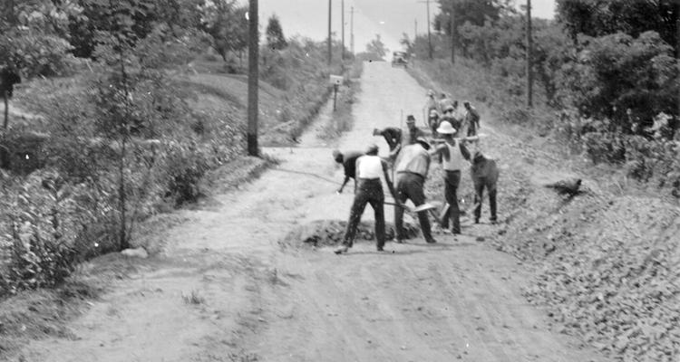 Project #1418, Master Project #2822 District 2: Workmen widening and grading the Straight Shoot Road, another Pendleton County road reconstruction job operated under Master Project #2822. The photograph was taken July 9, 1936