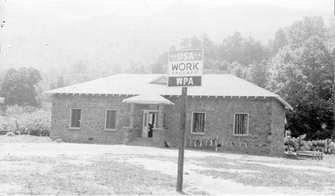 Project #1685 District 4: Project #1685 provided for the construction of a two-room rural school building at Hutch, KY. View, photographed July 22, 1936, shows the building nearing completion. Construction was of native stone