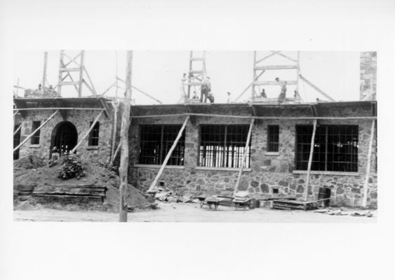 Project #1217 District 4: Construction of a twelve-room school building of native stone at Artemus, KY. The building is 144' X 52' in dimension. Partial view of front elevation of the Artemus School Building, with work in progress on second floor. Photograph taken July 24, 1936