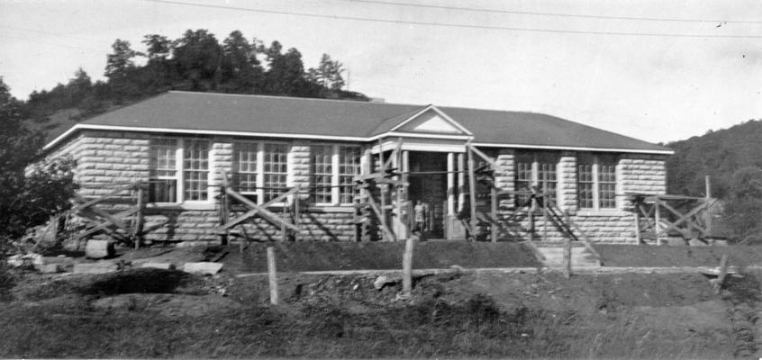 Project #583 District 4: A native stone school in Wolfe County. Construction of a native stone school building, one story high, at Hazel Green, KY. The structure contains four classrooms, a cloakroom, and an office. Front view of nearly completed Hazel Green School, photographed October 1, 1936