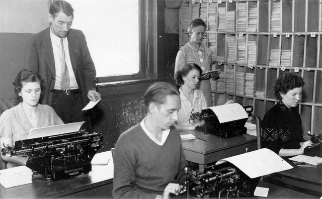 Project #2266 District 4: Knox County indexing project. White collar workers cross-indexing the Knox County Court records at Barbourville, KY. View photographed October 14, 1936