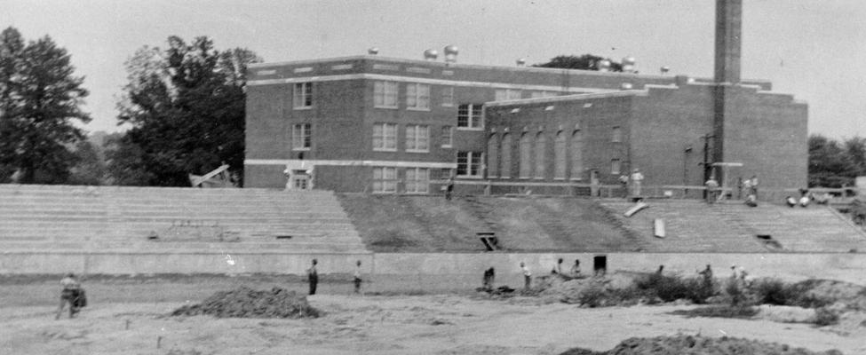 Project #2419 District 5: Two improvements for the Putnam Junior High School in the City of Ashland, KY, are the construction of a stadium and of a driveway abutting the school property. Under Project #2419 a reinforced concrete stadium is being built. This project also includes landscaping adjacent to the stadium and construction of necessary walkways. North bleachers, constructed of reinforced concrete, at Putnam Junior High School. View photographed August 6, 1936