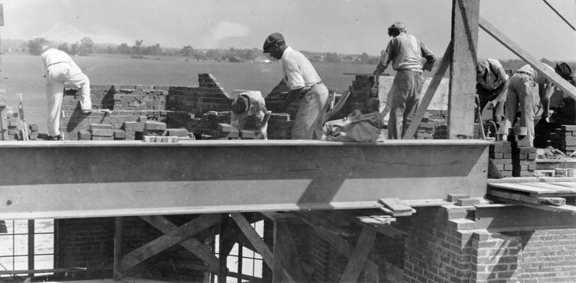 Project #2690 District 6: Remodeling and enlarging the Administration Building and other improvements at Bowman Field Airport, Louisville, KY. The work also includes changing walks and concrete mat to conform to the remodeled building. Bricklayers at work on the new wing to the Airport Administration Building. View photographed August 28, 1936
