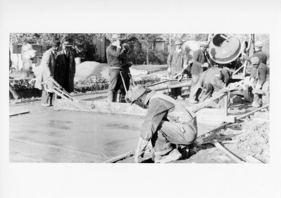 Project #3191 District 3: Improvement of Elizabeth Street in the City of Erlanger, KY. Workers shown finishing a section of concrete pavement on Elizabeth Street. View photographed November 9, 1936