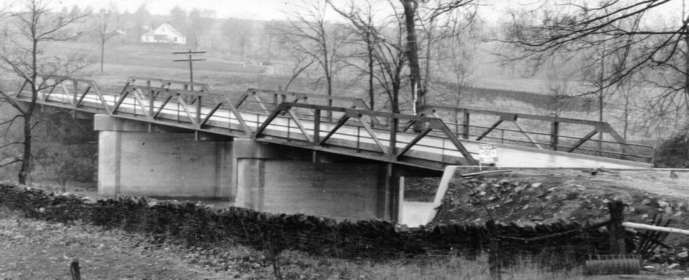 Project #2748 District 2: Under Serial Number 2-84-55, Crew #15 of Master Road Project #2748 constructed the Forsythe Mill Bridge in Mercer County. This bridge is of steel and concrete construction. View photographed December 29, 1936