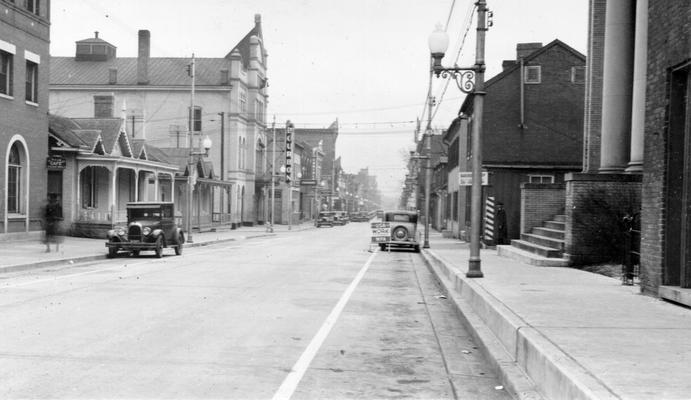 Project #3048 District 3: Master Project #3048, which was completed November 24, 1936, provided for the construction of concrete sidewalks in various parts of Paris, KY. View, taken December 18, 1936, showing completed concrete sidewalk on Main Street