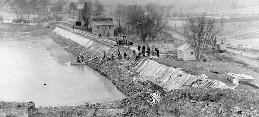 Project #1728 District 4: Improvements to the city water works system in Richmond, KY. View, photographed December 16, 1936, shows workmen constructing a dam for the Richmond Waterworks Reservoir