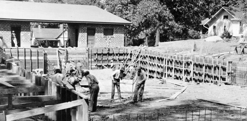 Project #2312 District 1: Construction of a swimming pool, bath houses and tennis courts in a park at Central City, KY. View shows form work for the reinforced concrete walls of the swimming pool, photographed September 25, 1936