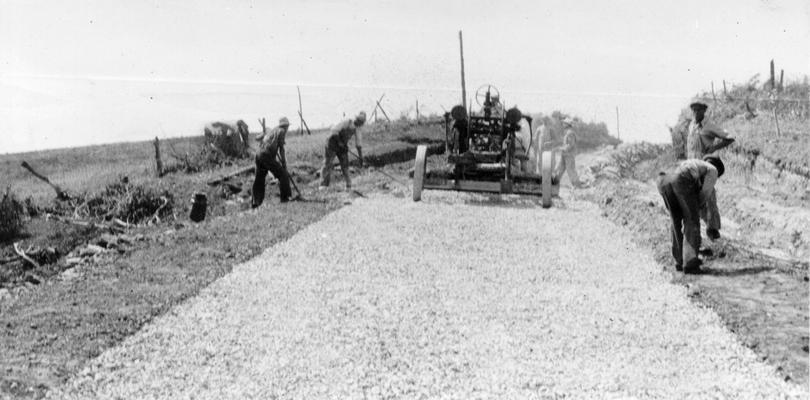 Project #2806 District 2: Project #2806 provides for the repairing and improving of various roads in Garrard County, including the grading, draining and surfacing with crushed limestone the Buena Vista Road for a distance of 5 miles. Crushed limestone surface placed on Buena Vista Road. Photographed July 30, 1936