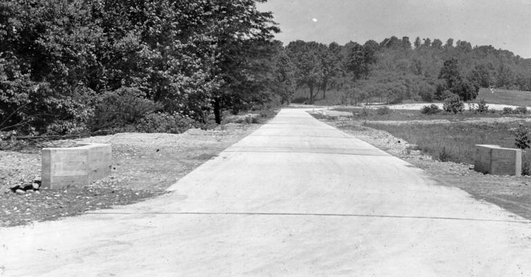 Project #1036 District 6: Rear entrance road to Waverly Hills.Construction of a concrete rear entrance road to Waverly Hills Sanitarium, a tuberculosis hospital near Louisville, KY, has been completed under Project #1036. The new concrete rear entrance road to Waverly Hills Sanitarium. View photographed June 8, 1936