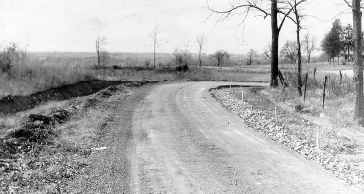 Project #250, Master Project #2784 District 6: Project #250, now a part of Master Project #2784, provided for the reconstruction of 4 miles of the Route Road and the Ferman Road in Jefferson County. View shows additional base placed to permit a wider surface prior to application of the wearing surface, photographed November 6, 1935